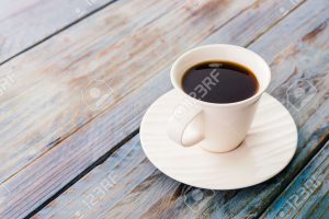 38268113-Coffee-cup-on-wooden-tables-vintage-effect-style-pictures-Stock-Photo
